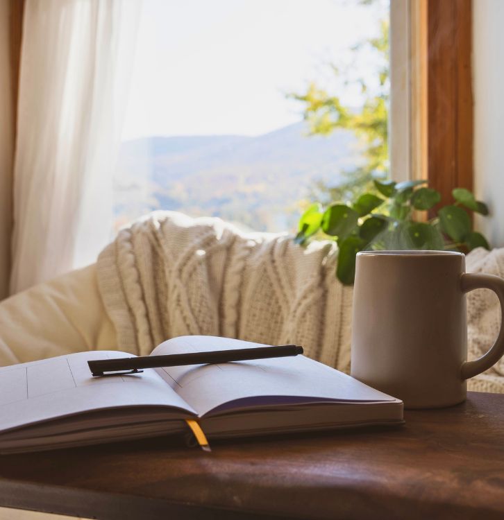 A peaceful setting featuring a notebook on a table