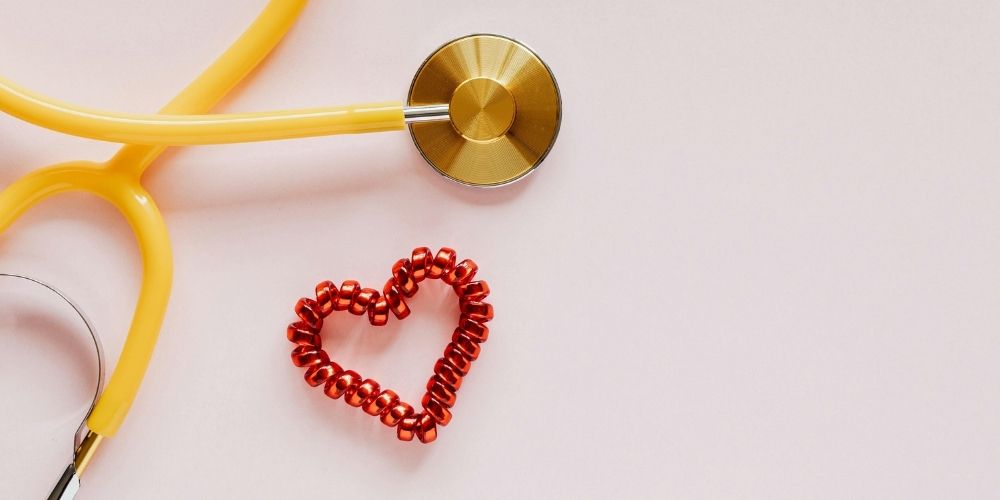 red valentines heart and stethoscope
